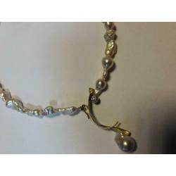Exclusief collier twinparels, 14 karaat geelgoud en diamant