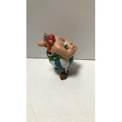 Obelix handen op rug