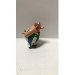 Obelix handen op rug