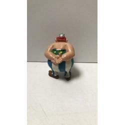 Obelix handen op rug