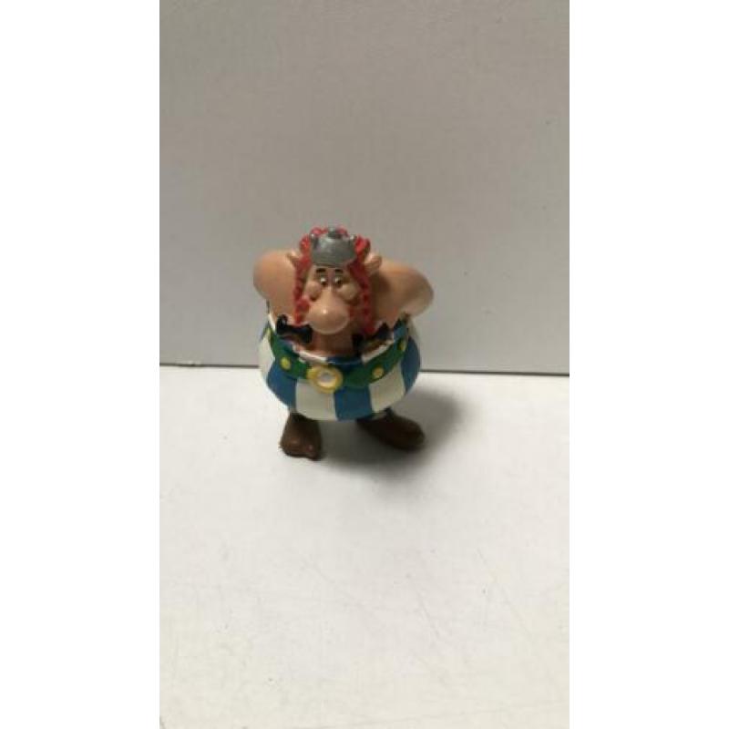 Obelix handen op rug
